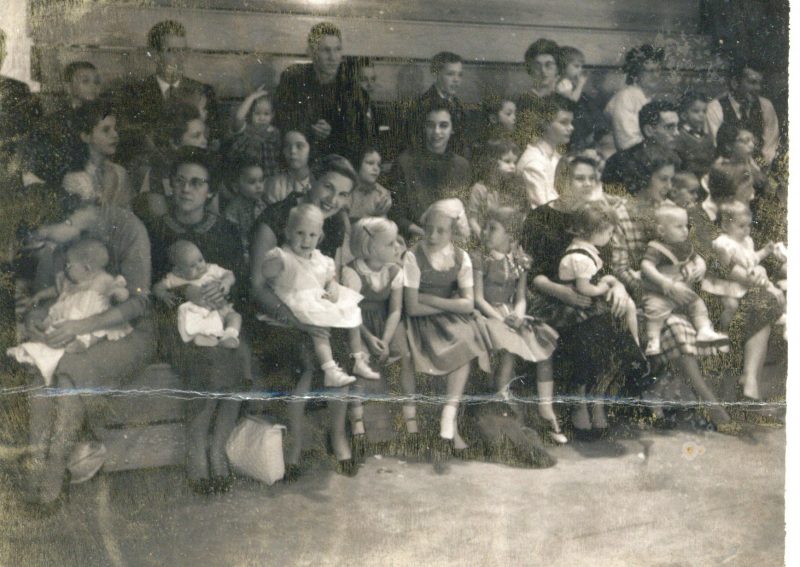 Parents and kids in bleachers waiting for show